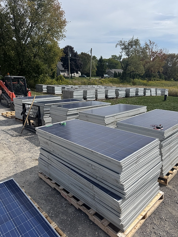 Commercial solar panels staged for recycling and transport